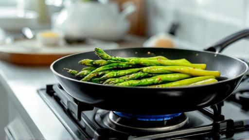 Asparagus cooking in skillet